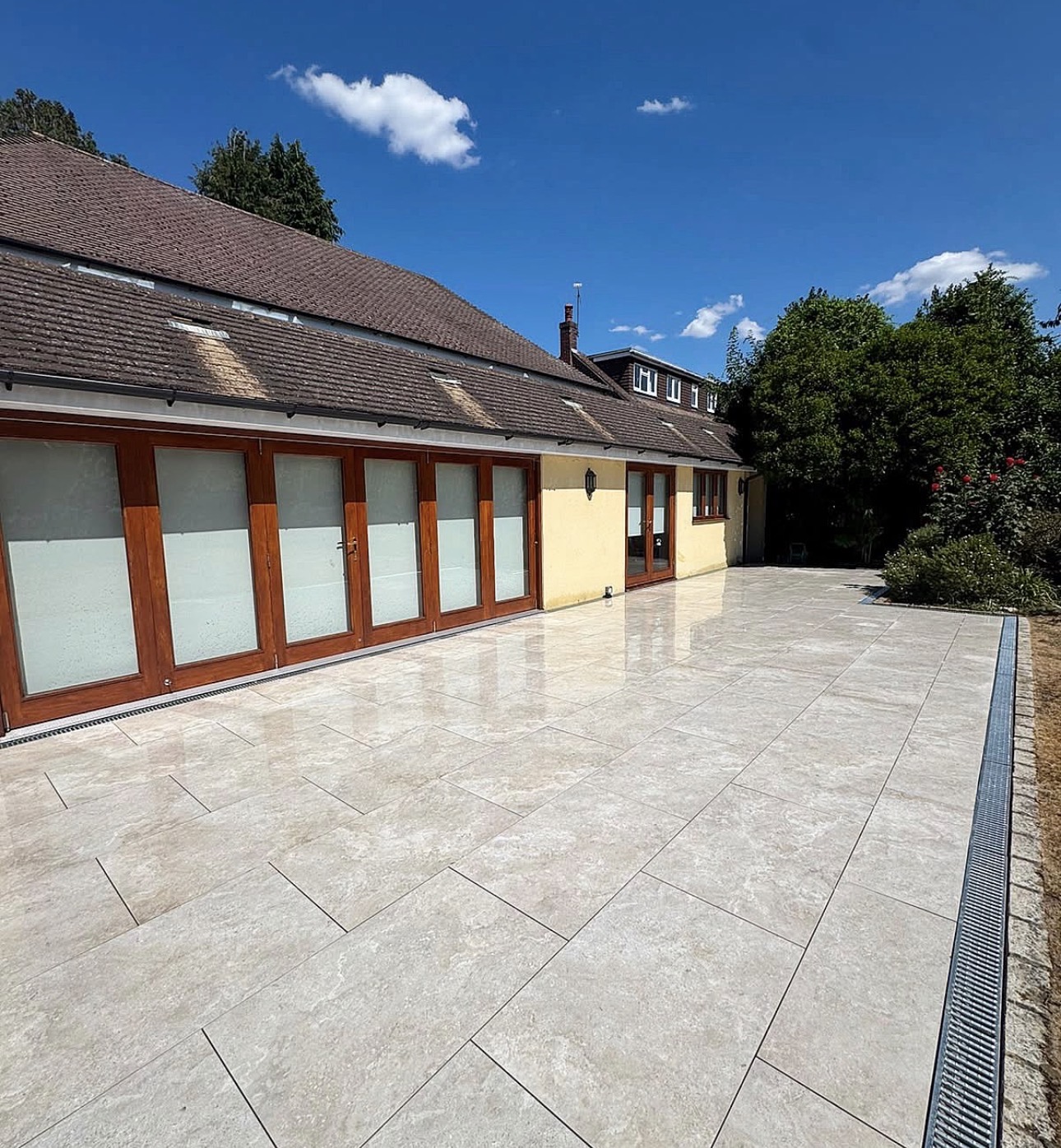 Large porcelain patio with channel drainage